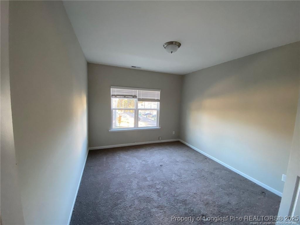 1206 Wingstem Place Raleigh, NC 27607 - Photo 6 of 17 an empty room with a window