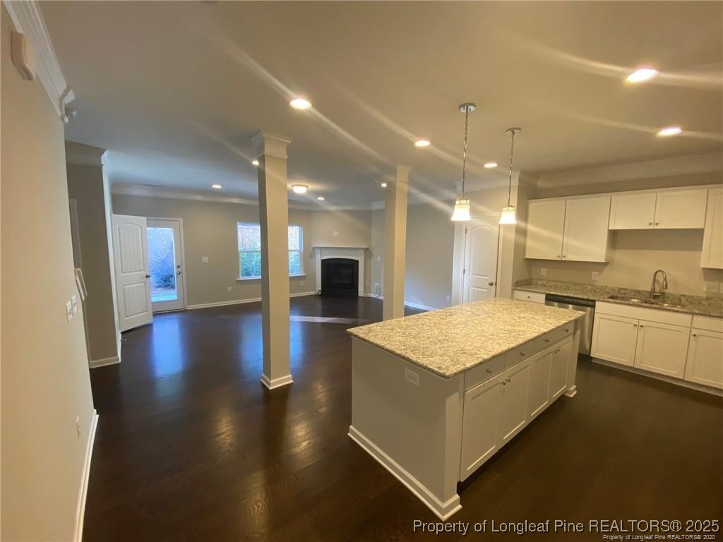 1206 Wingstem Place Raleigh, NC 27607 - Photo 10 of 17 a large kitchen with stainless steel appliances a large counter top and a stove
