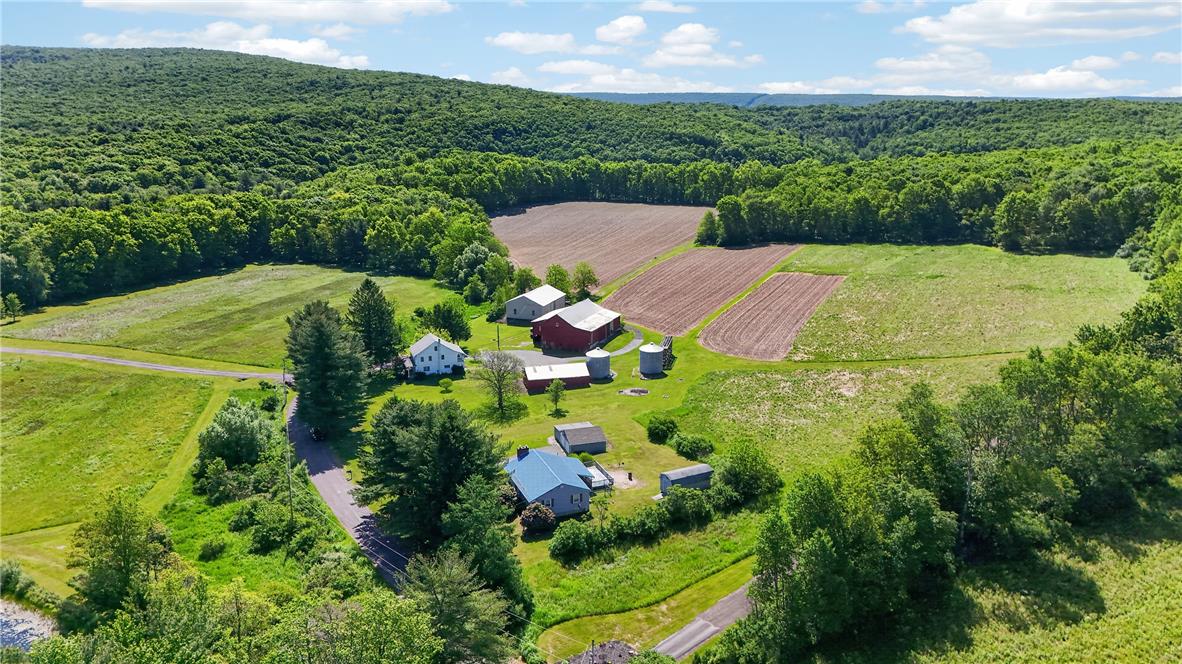 62 Stoney Road Tamaqua, PA 18252 - Photo 57 of 61 Sprawling rural property with multiple structures, surrounded by verdant hills and agricultural fields.
