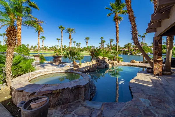 a view of a backyard with sitting area