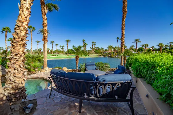 a patio with table and chairs