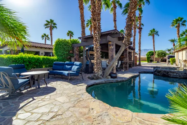 a view of a swimming pool with a lounge chairs