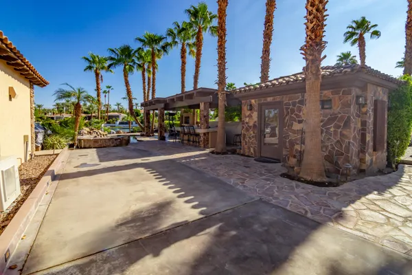 a view of a chairs and table in the patio