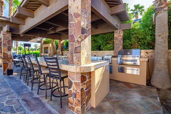a view of outdoor dining space with a table and chairs
