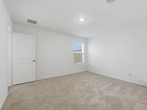 an empty room with a empty space and window