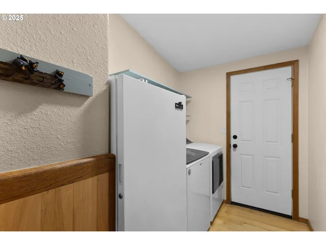 a kitchen with a refrigerator and cabinets