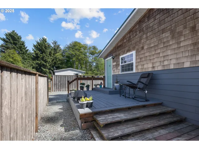 a view of a backyard with sitting area