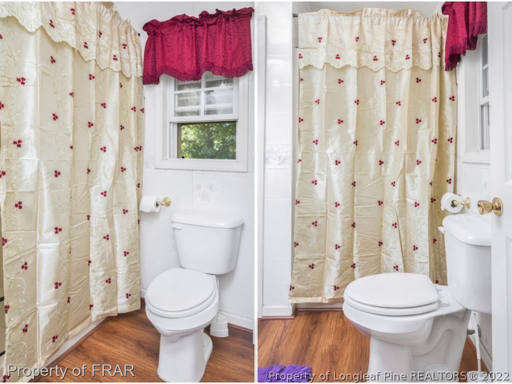 5253 Lobelia Road Vass, NC 28394 - Photo 17 of 28 a bathroom with a toilet and a shower curtain