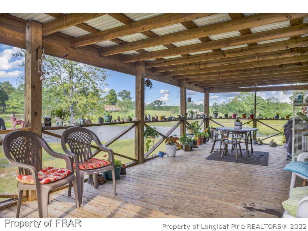 5253 Lobelia Road Vass, NC 28394 - Photo 21 of 28 a view of a chairs and table in the patio