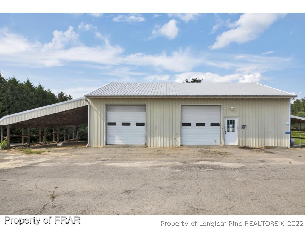 5253 Lobelia Road Vass, NC 28394 - Photo 24 of 28 a view of a house with a garage