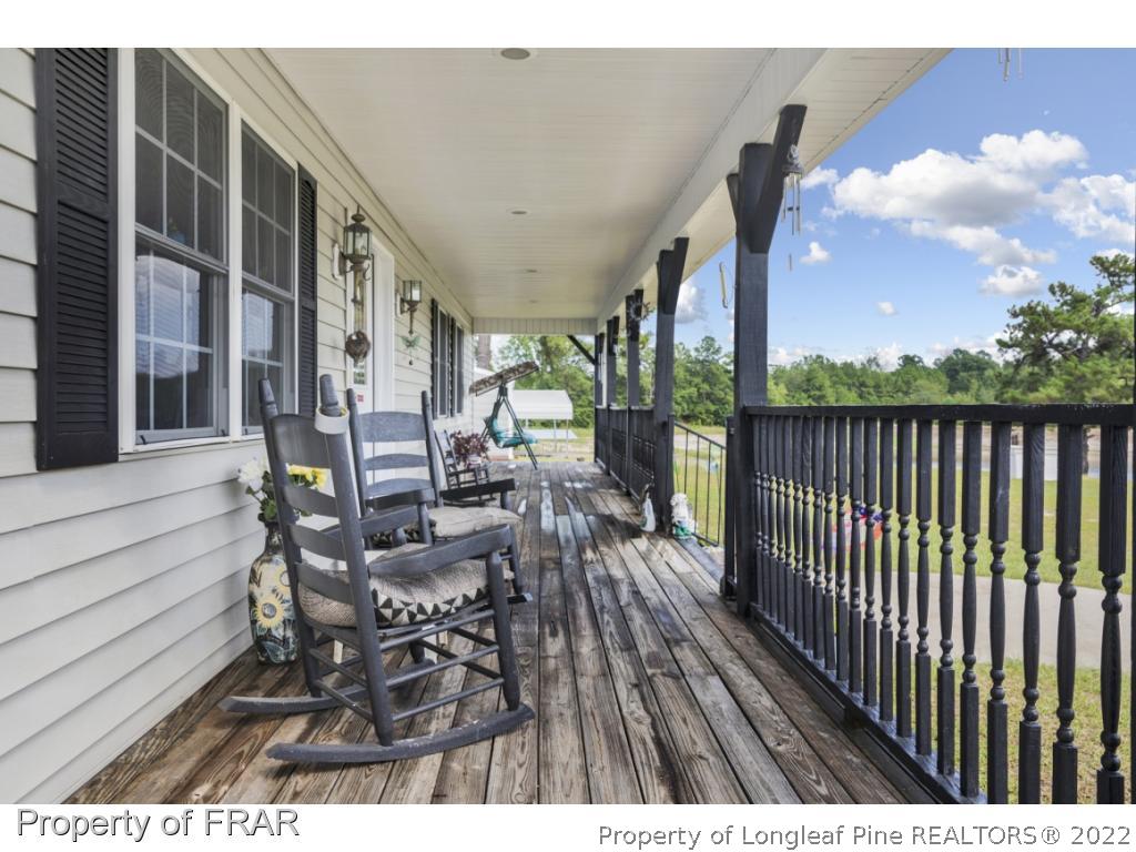 5253 Lobelia Road Vass, NC 28394 - Photo 7 of 28 a view of balcony with furniture