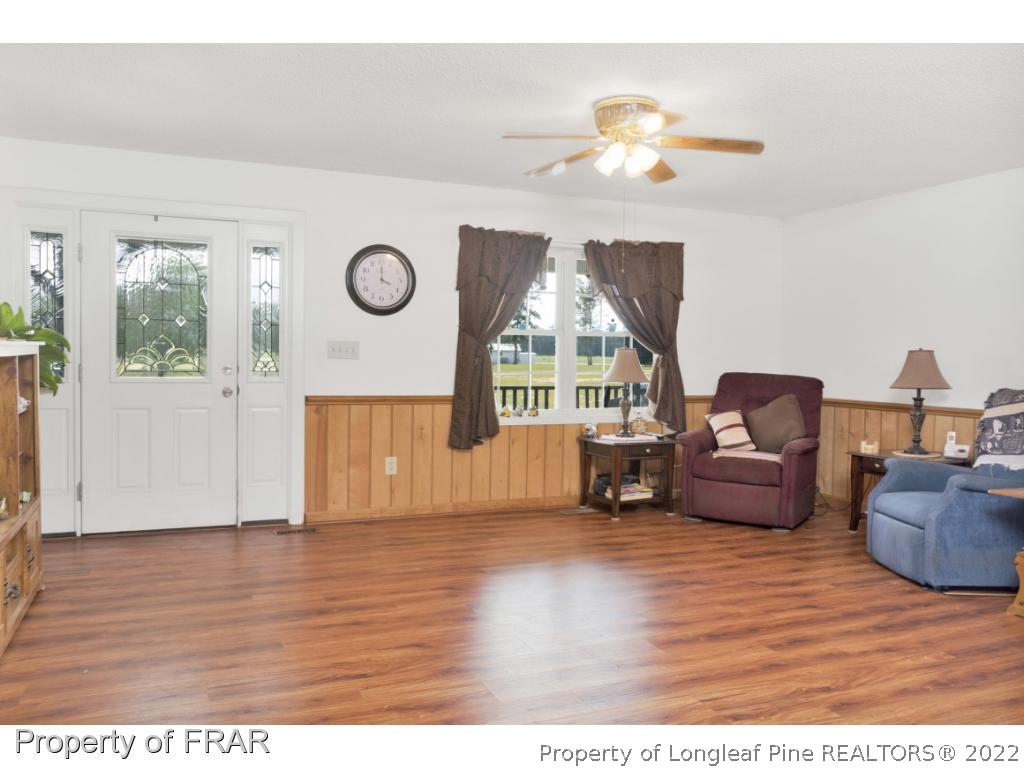5253 Lobelia Road Vass, NC 28394 - Photo 9 of 28 a living room with furniture and a window