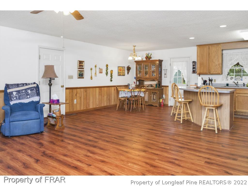 5253 Lobelia Road Vass, NC 28394 - Photo 10 of 28 a living room with furniture and a wooden floor
