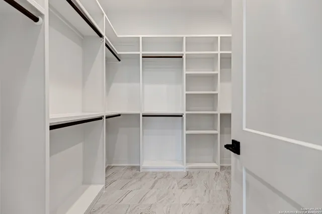 a view of an empty walk in closet