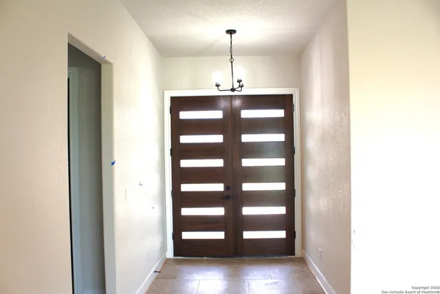 a view of a kitchen with a sink and a window