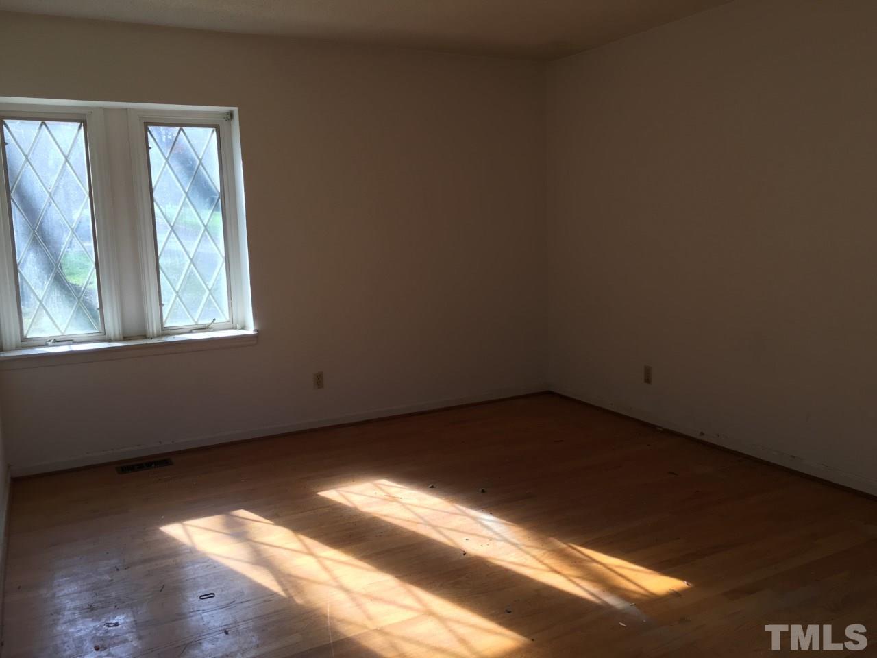 3312 Boulder Court Raleigh, NC 27607 - Photo 7 of 9 a view of an empty room and window