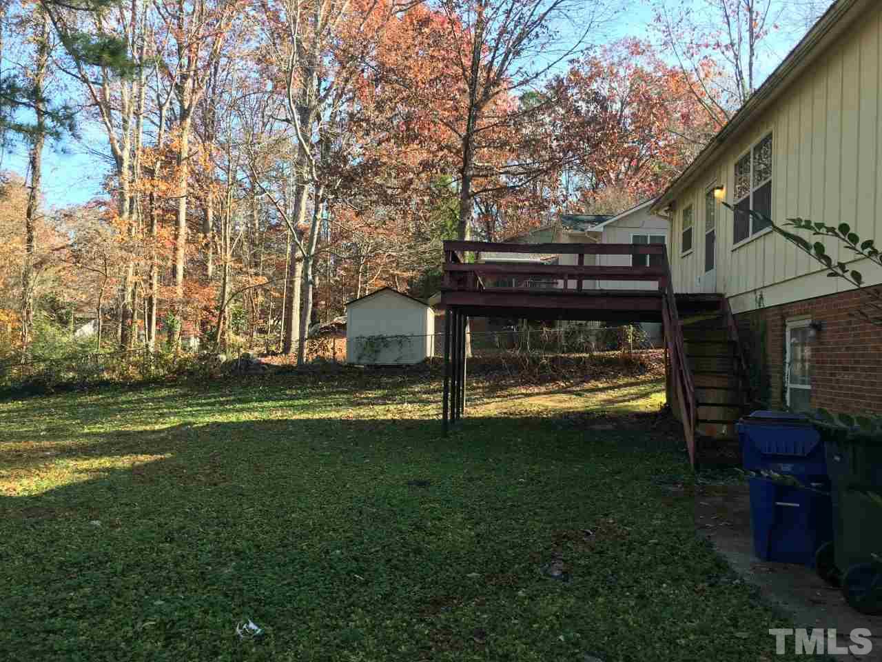 3312 Boulder Court Raleigh, NC 27607 - Photo 8 of 9 a view of a house with a yard