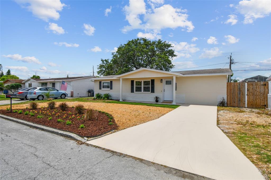 3850 Carioca Road Holiday, FL 34691 - Photo 1 of 1 a front view of a house with a yard