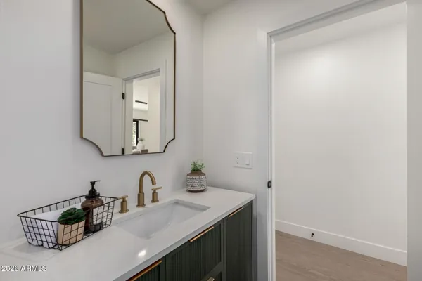 a bathroom with a sink and a mirror