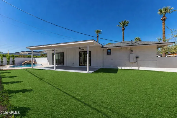 a front view of a house with a garden