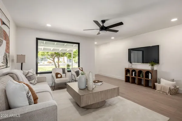 a living room with furniture and a flat screen tv