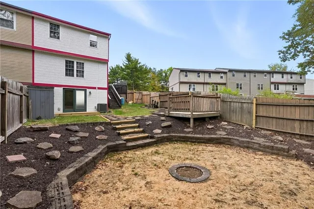 a view of a backyard with sitting area