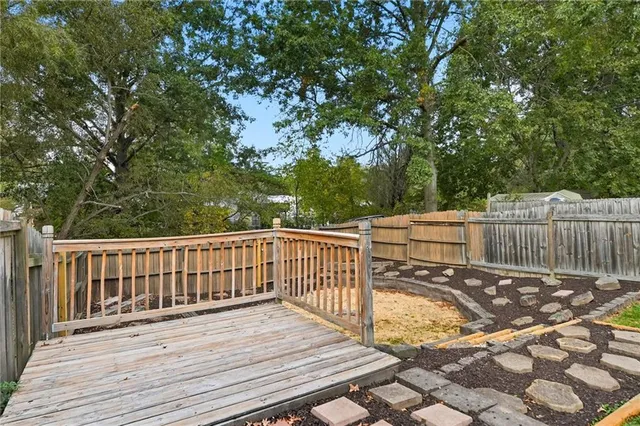 a view of deck with wooden floor and fence