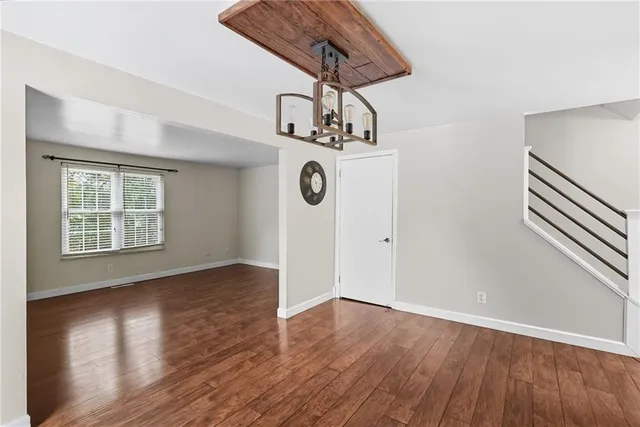 a view of an entryway with wooden floor