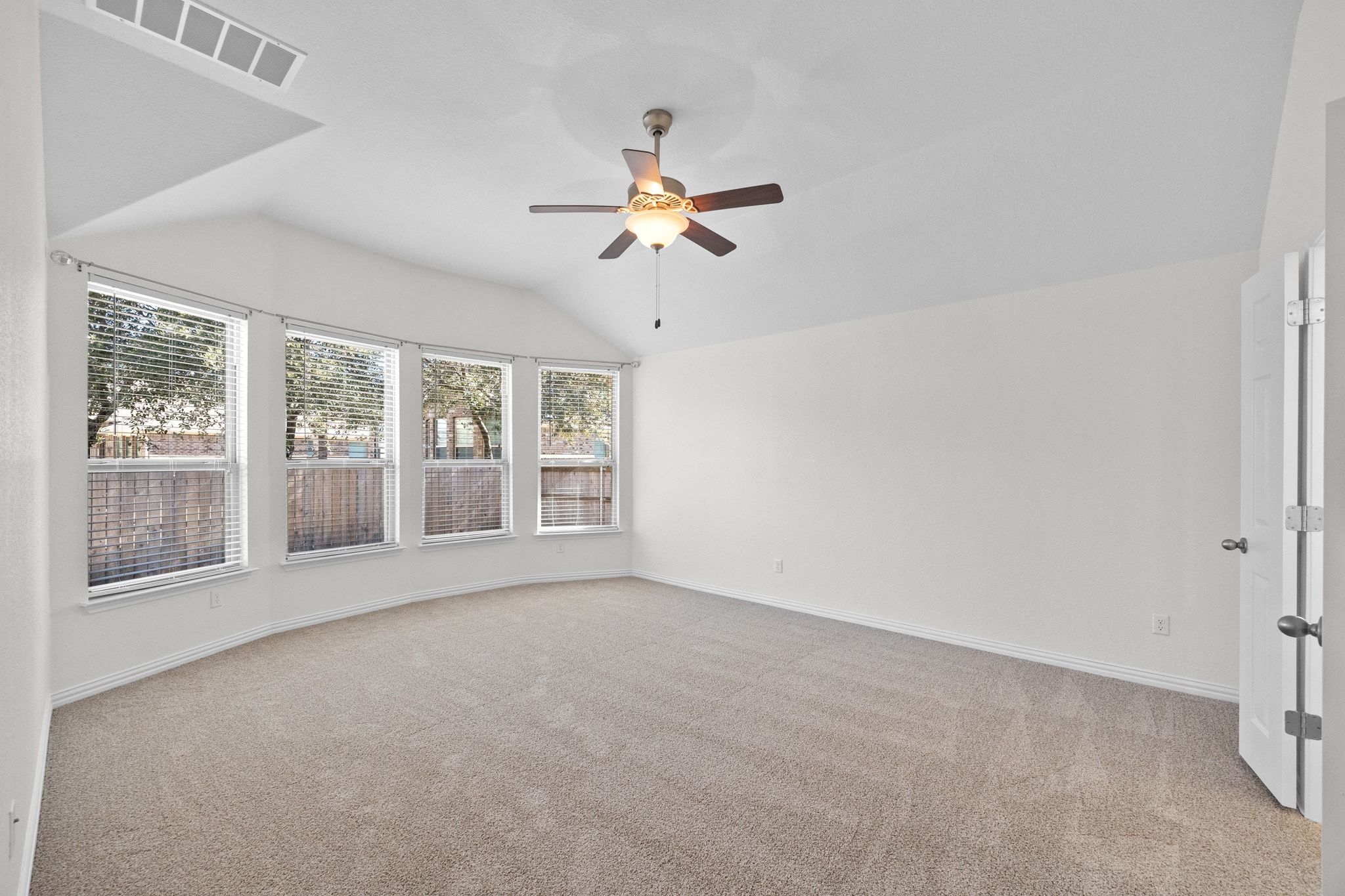 228 Sangiovese Leander, TX 78641 - Photo 14 of 32 a view of a room with a ceiling fan and window