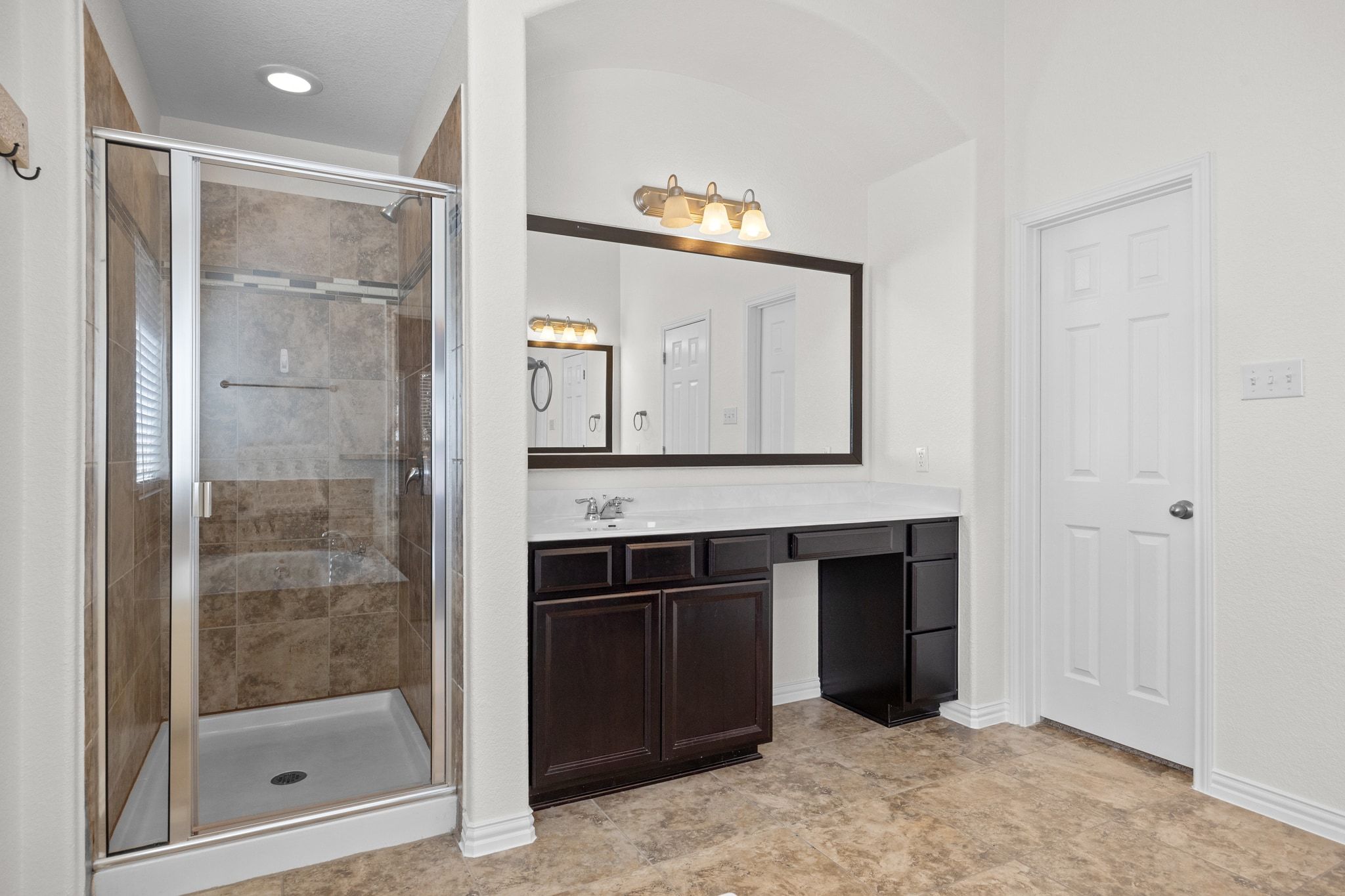 228 Sangiovese Leander, TX 78641 - Photo 17 of 32 a bathroom with a sink and a mirror