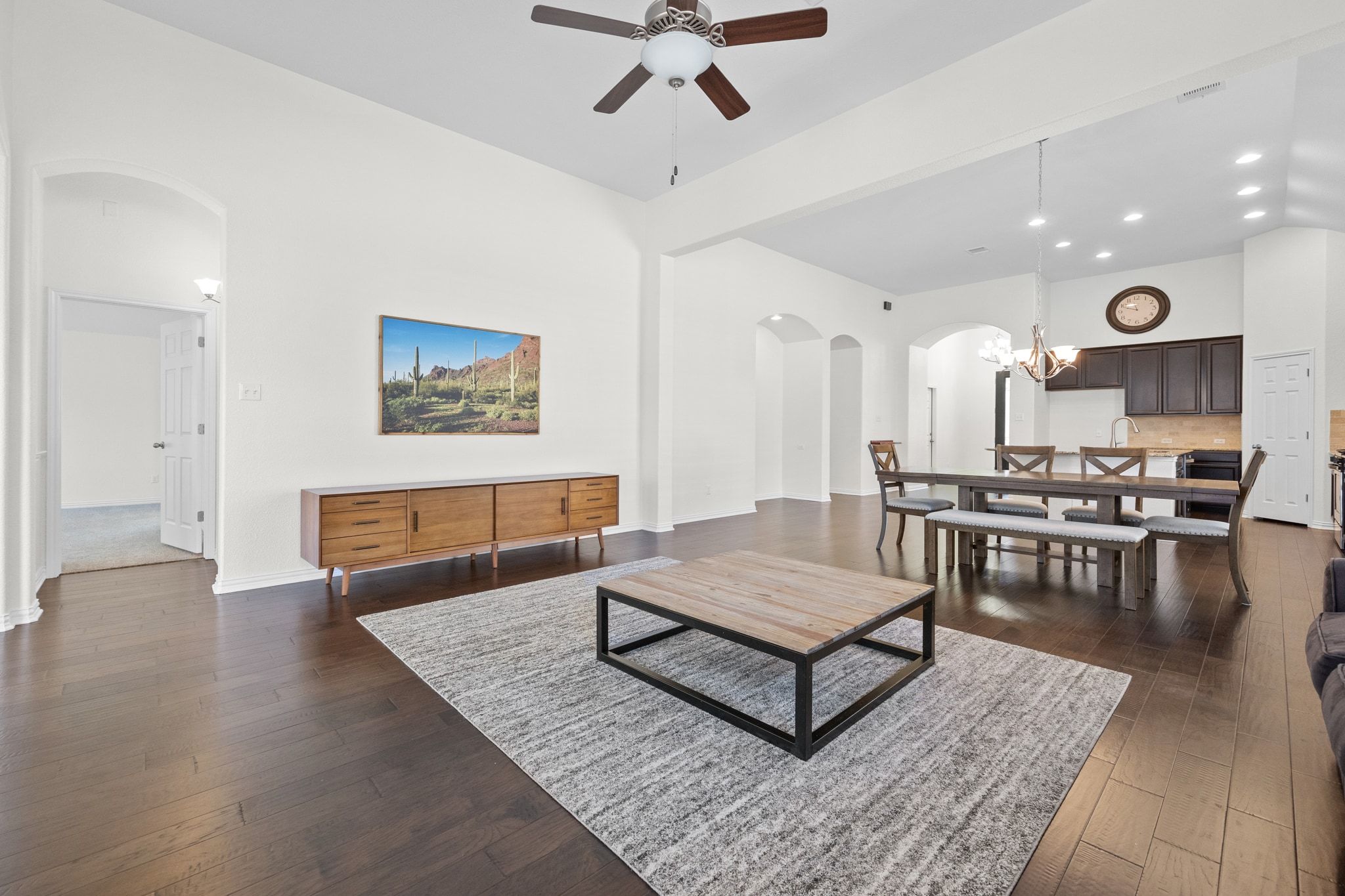 228 Sangiovese Leander, TX 78641 - Photo 3 of 32 a living room with dining room and wooden floor