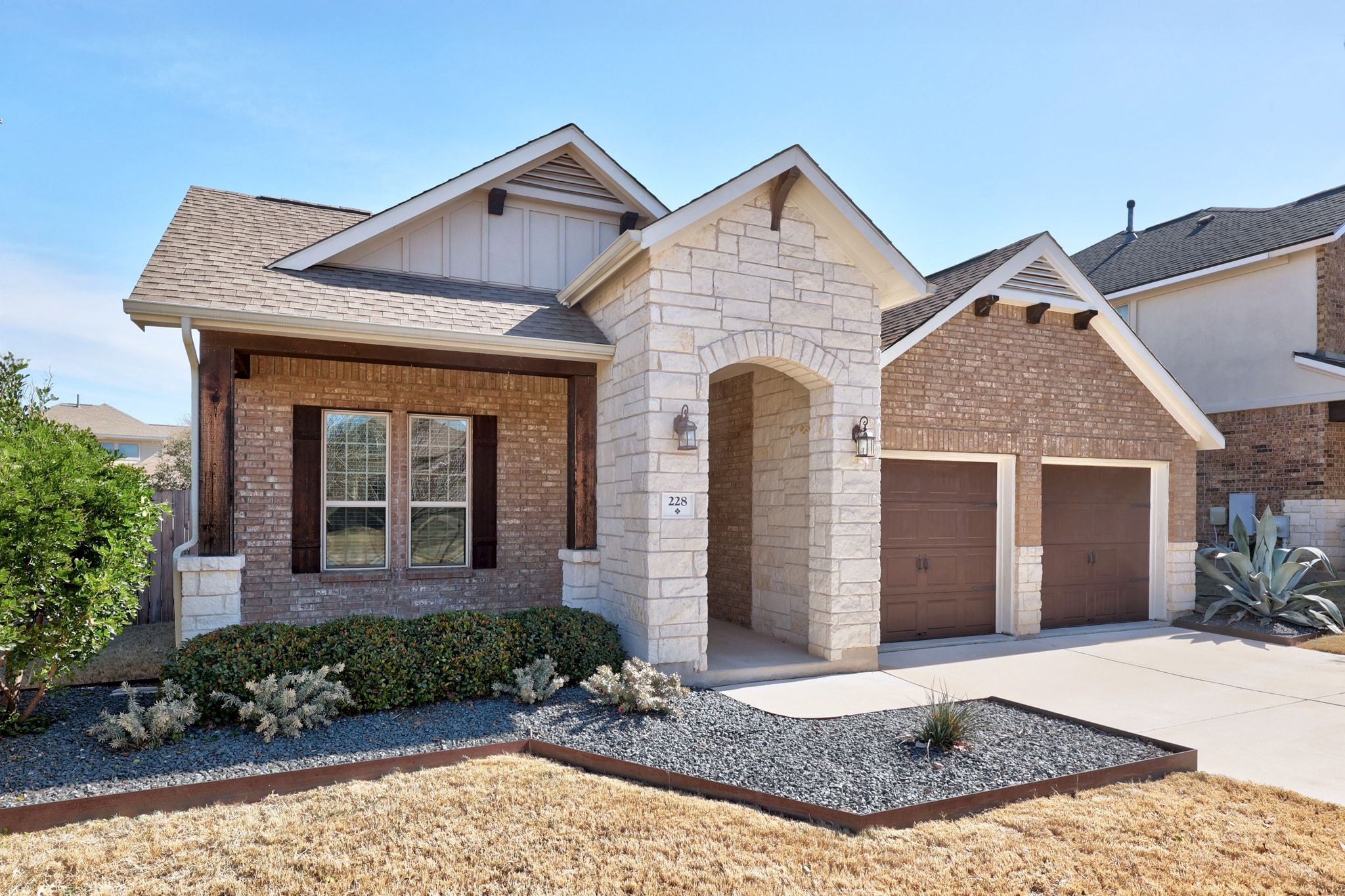 228 Sangiovese Leander, TX 78641 - Photo 30 of 32 a view of a brick house with large windows
