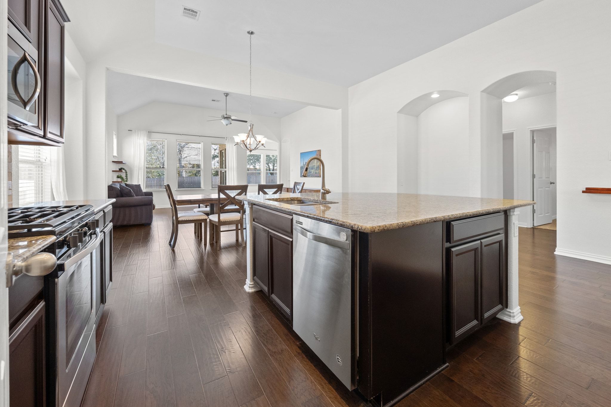 228 Sangiovese Leander, TX 78641 - Photo 32 of 32 a kitchen with stainless steel appliances granite countertop a stove and cabinets