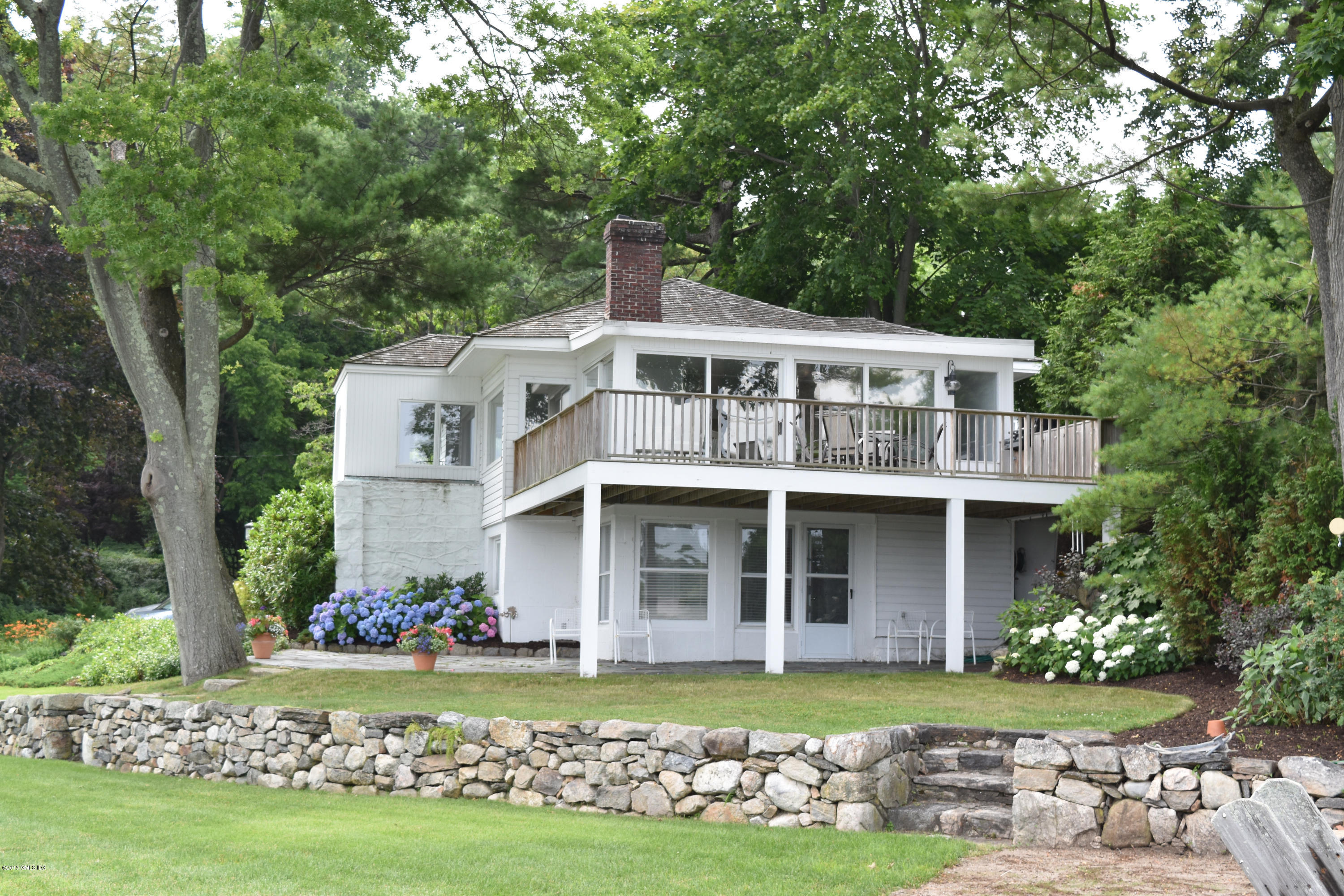 25 Willowmere Avenue Riverside, CT 06878 - Photo 12 of 12 front view of a house with a yard