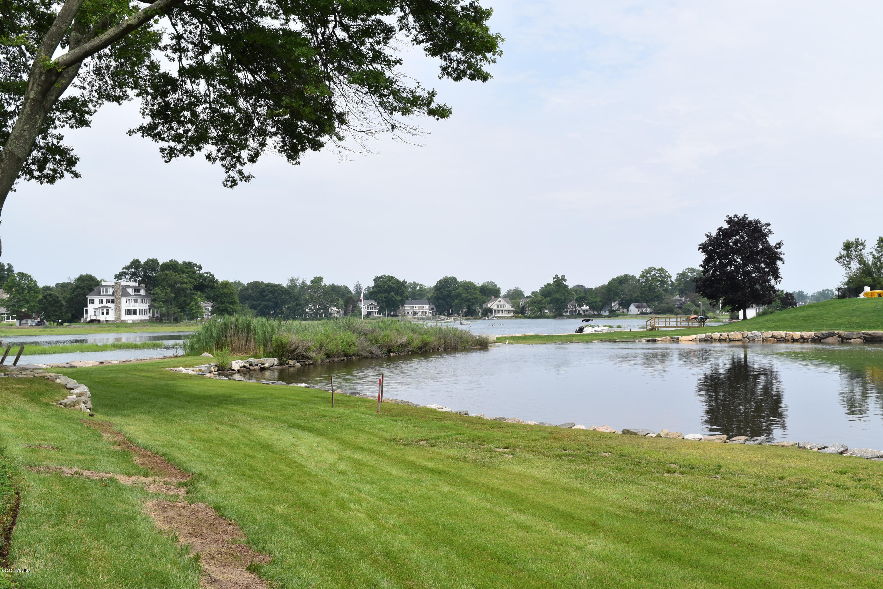 25 Willowmere Avenue Riverside, CT 06878 - Photo 2 of 12 a view of a lake from a yard