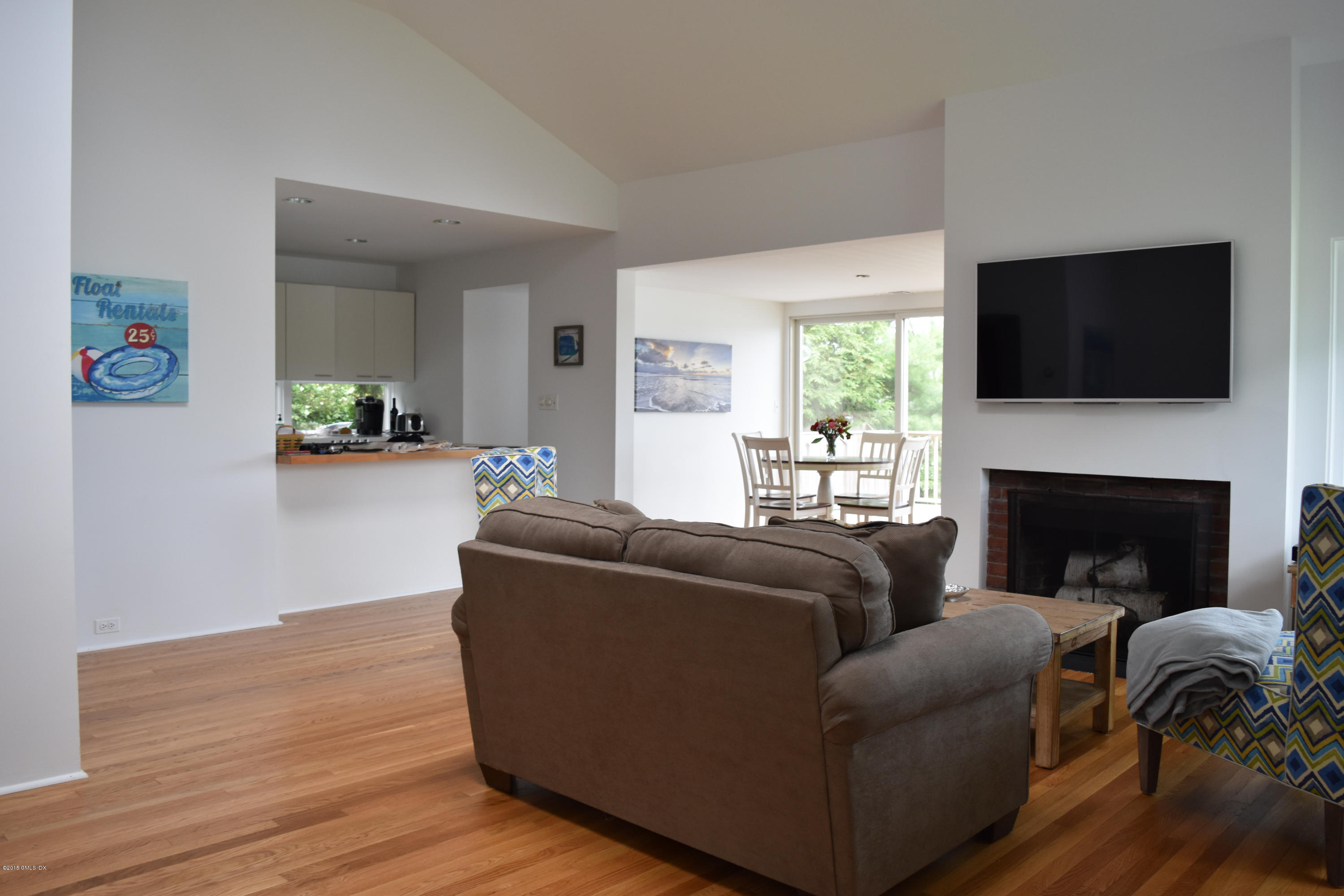 25 Willowmere Avenue Riverside, CT 06878 - Photo 3 of 12 a living room with furniture and a fireplace