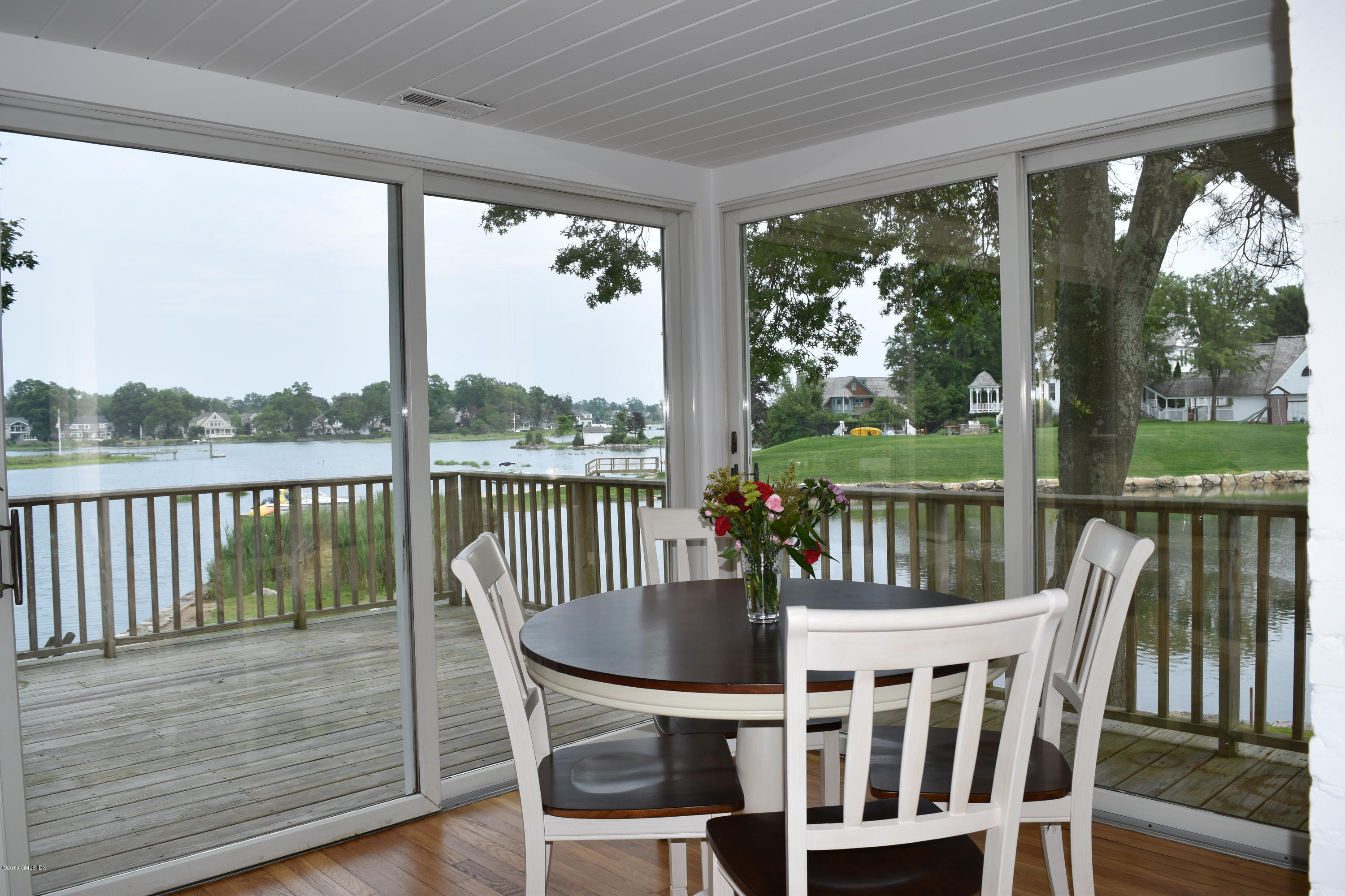 25 Willowmere Avenue Riverside, CT 06878 - Photo 5 of 12 a view of a balcony with a table and chairs