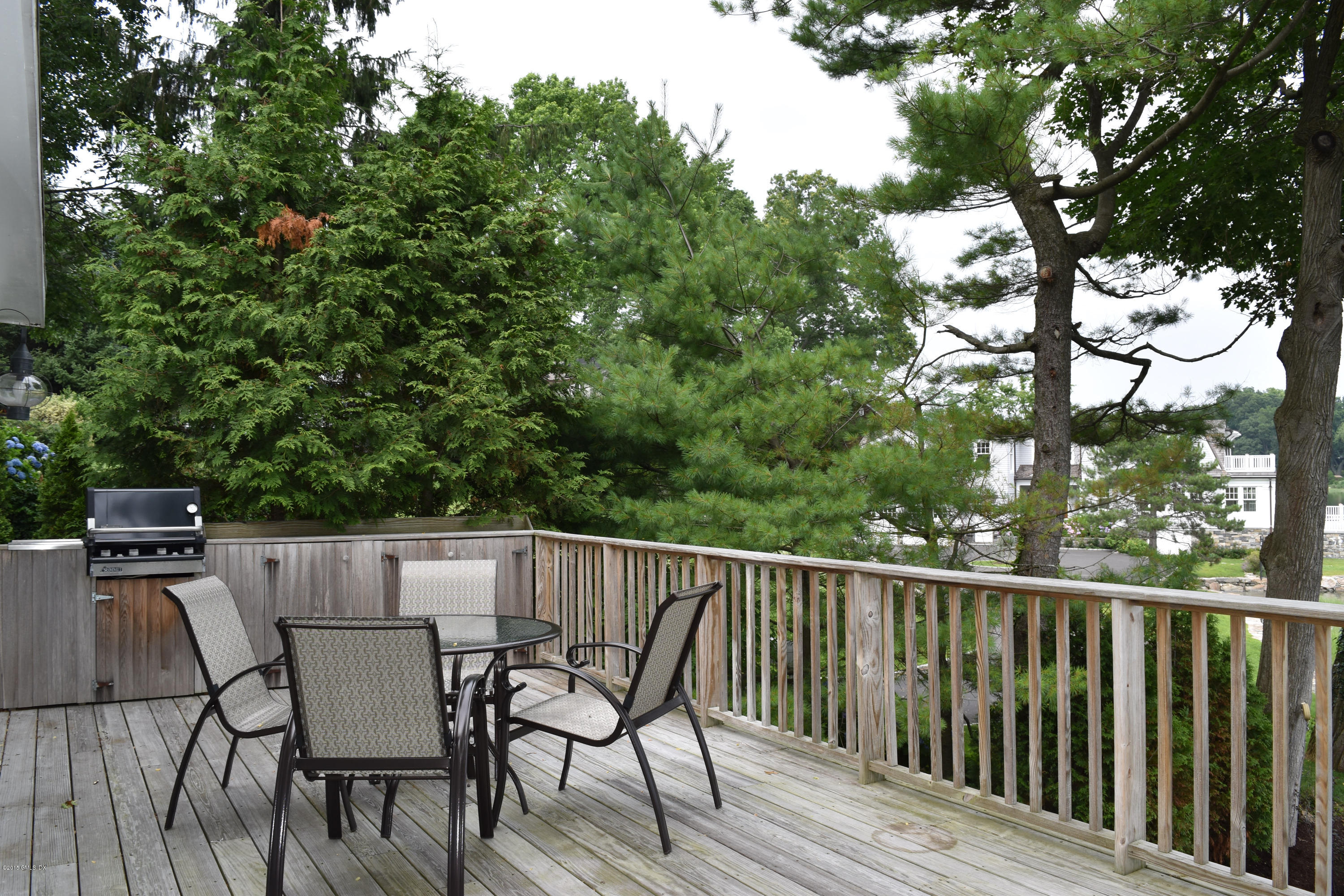 25 Willowmere Avenue Riverside, CT 06878 - Photo 7 of 12 a view of a wooden bench on the roof deck