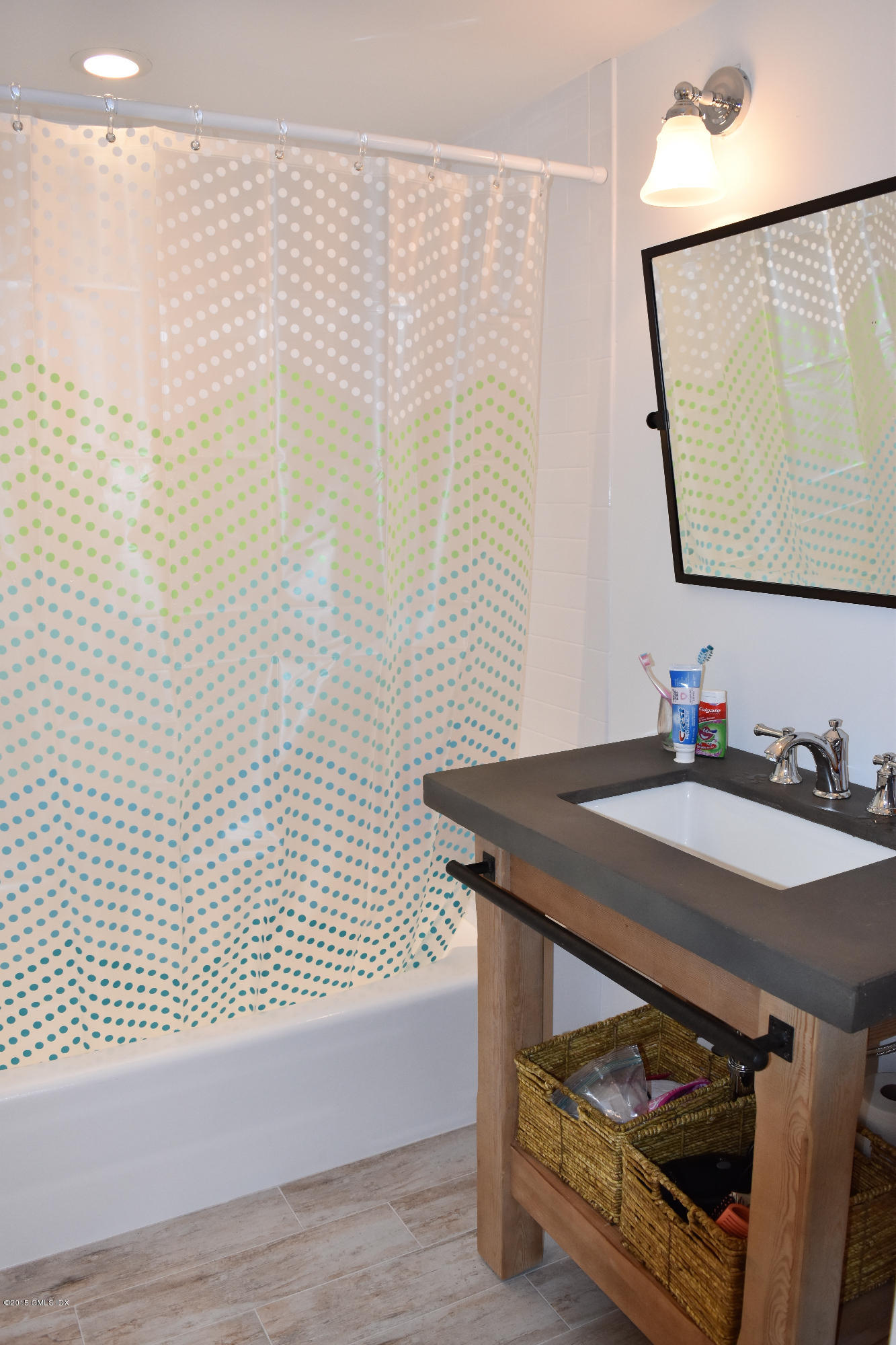 25 Willowmere Avenue Riverside, CT 06878 - Photo 9 of 12 a bathroom with a sink and a mirror