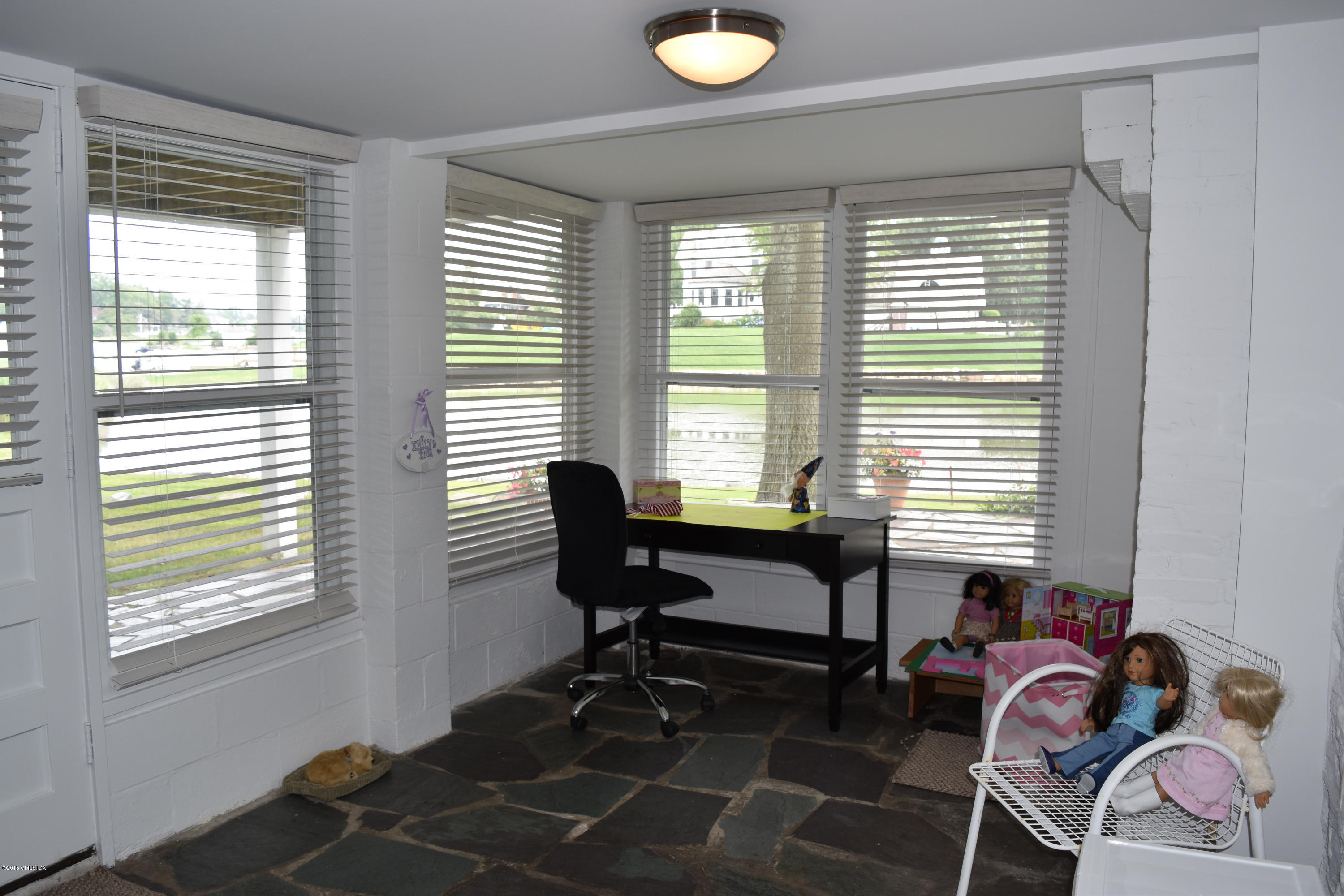 25 Willowmere Avenue Riverside, CT 06878 - Photo 10 of 12 a view of a workspace with furniture and a window