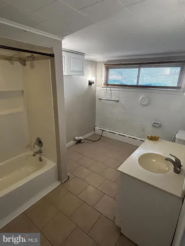 a bathroom with a sink and a bathtub