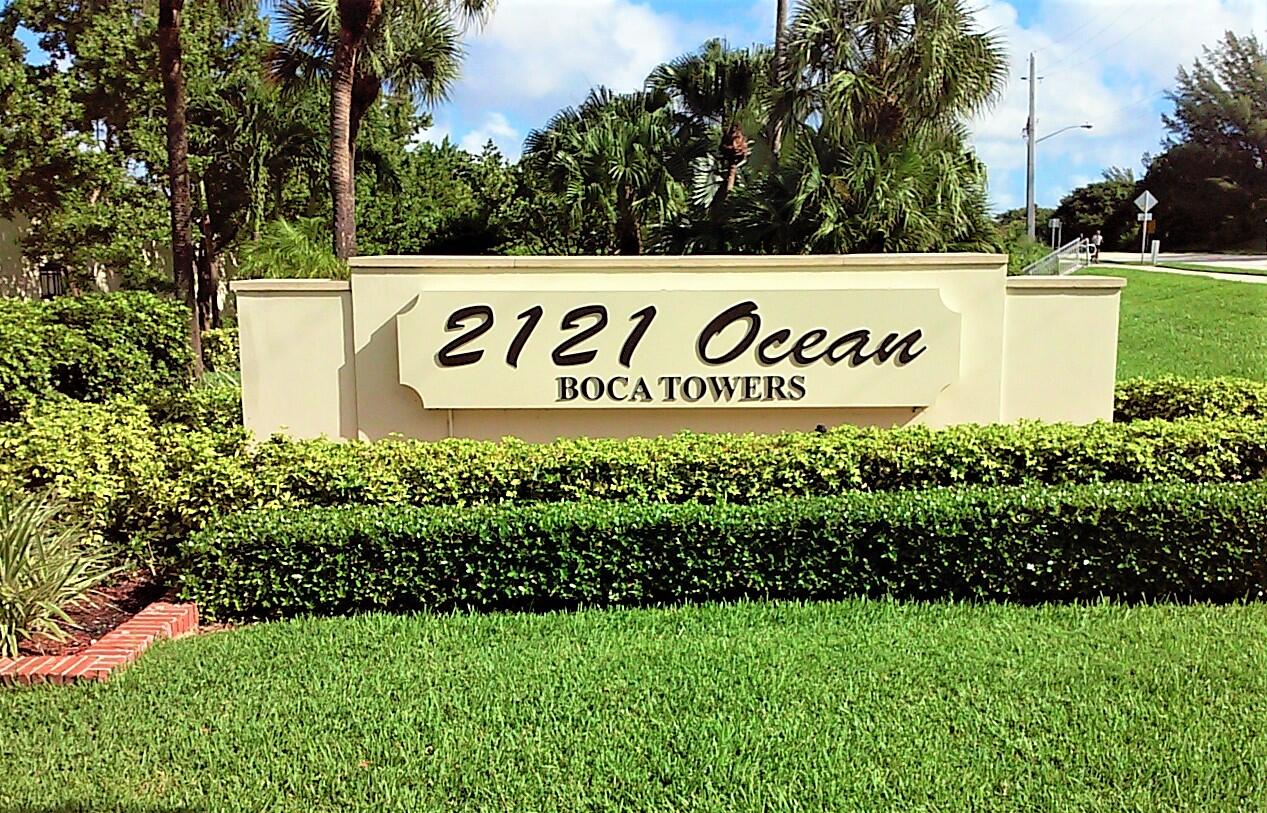 2121 North Ocean Boulevard, Unit 1205E Boca Raton, FL 33431 - Photo 2 of 54 a sign broad in front of flowers