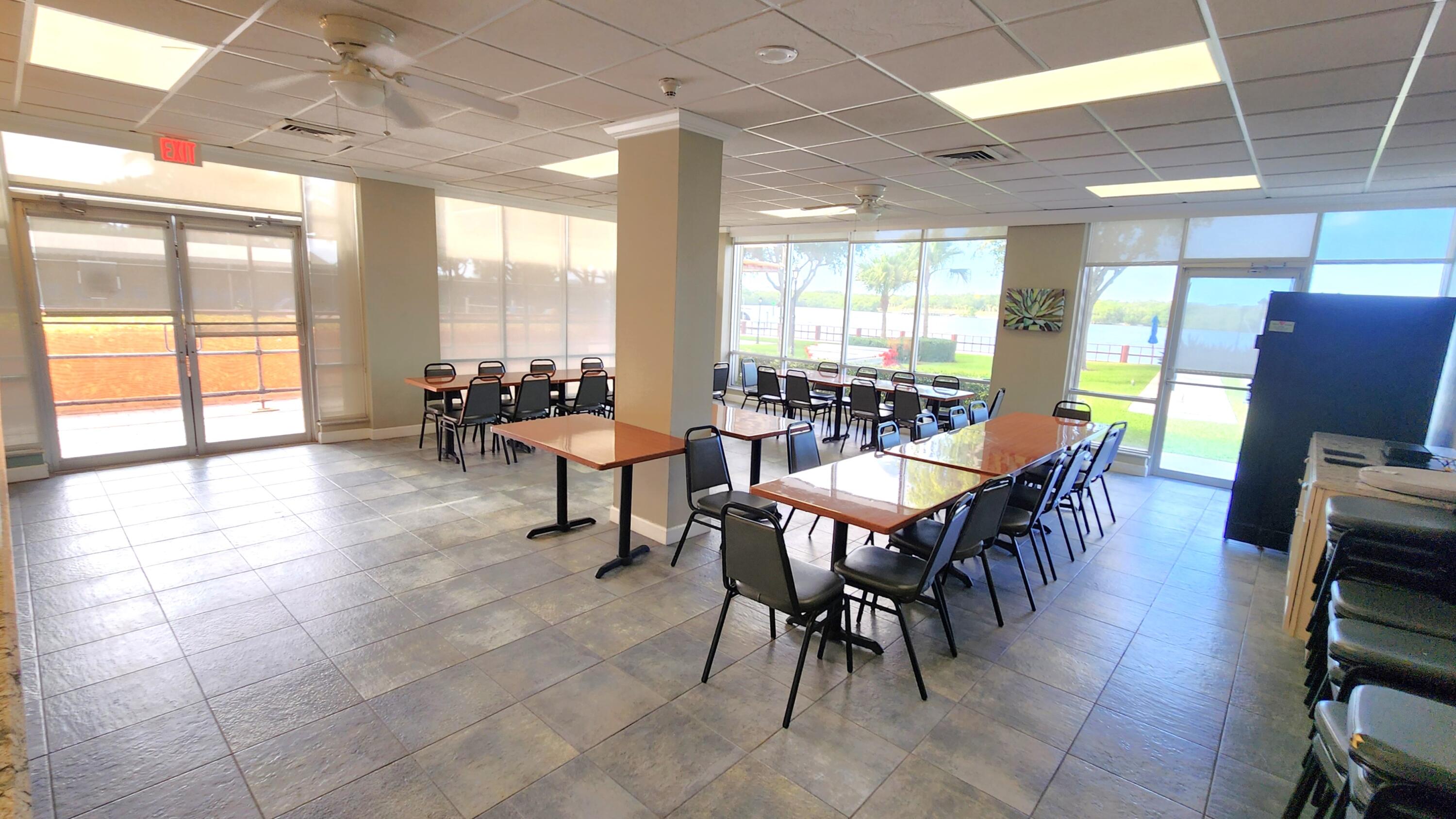 2121 North Ocean Boulevard, Unit 1205E Boca Raton, FL 33431 - Photo 35 of 54 a view of a dining room with furniture window and outside view