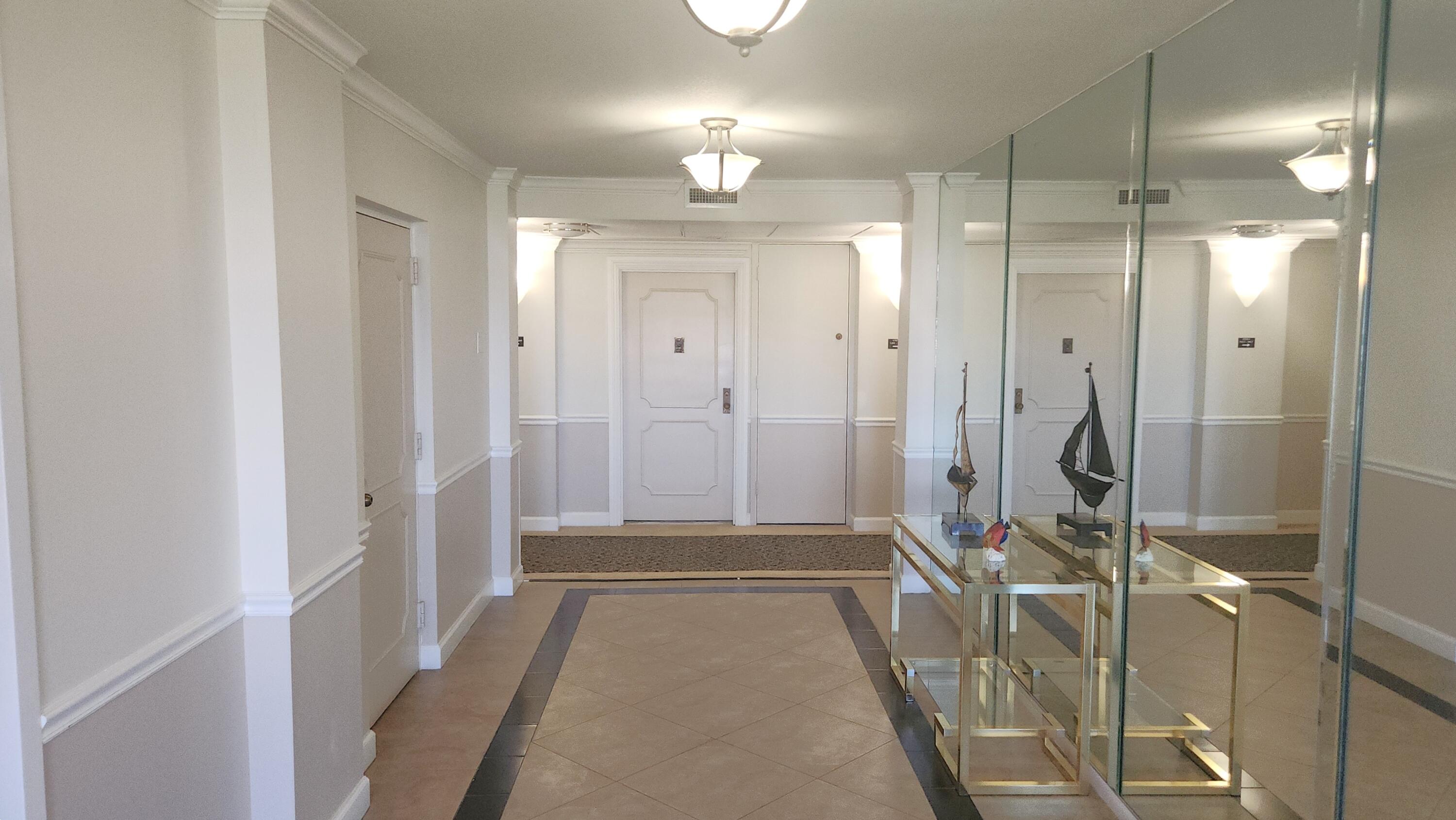 2121 North Ocean Boulevard, Unit 1205E Boca Raton, FL 33431 - Photo 7 of 54 a bathroom with a shower and a mirror