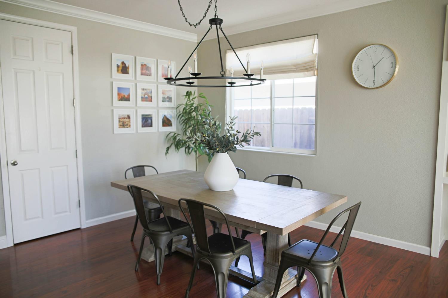 12372 Pawcatuck Way Rancho Cordova, CA 95742 - Photo 11 of 48 a view of a dining room with furniture window and wooden floor