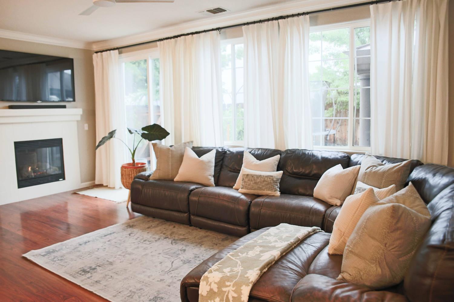 12372 Pawcatuck Way Rancho Cordova, CA 95742 - Photo 13 of 48 a living room with furniture window and a flat screen tv