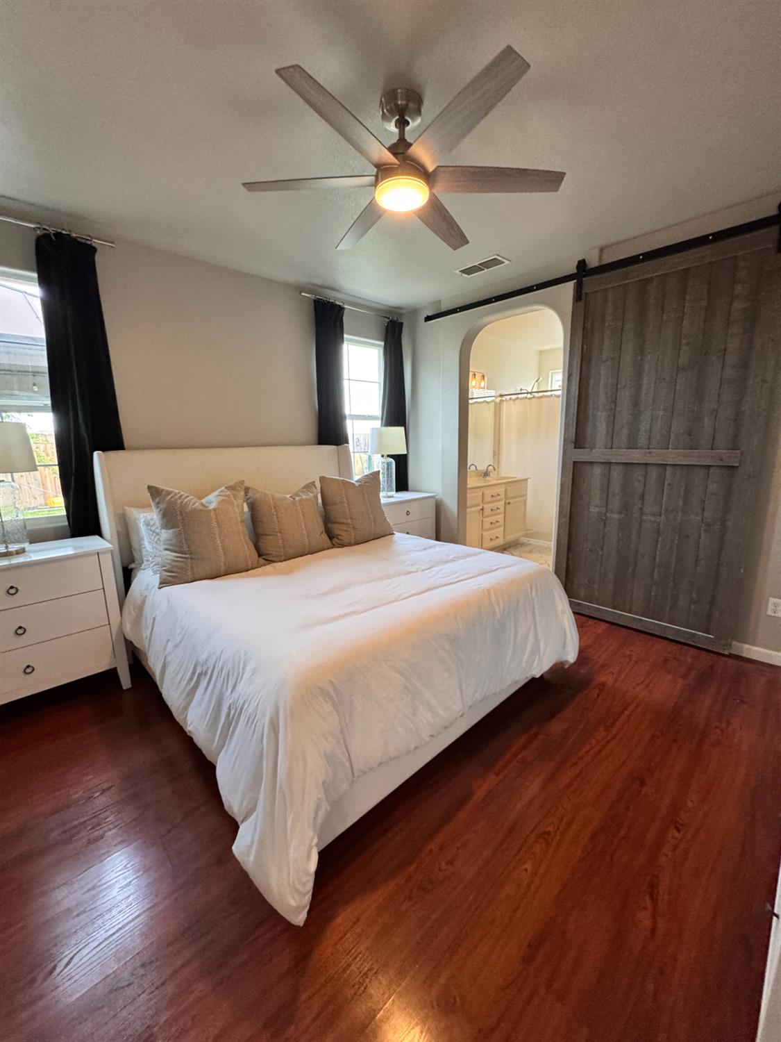 12372 Pawcatuck Way Rancho Cordova, CA 95742 - Photo 18 of 48 a bedroom with a large bed and a large window