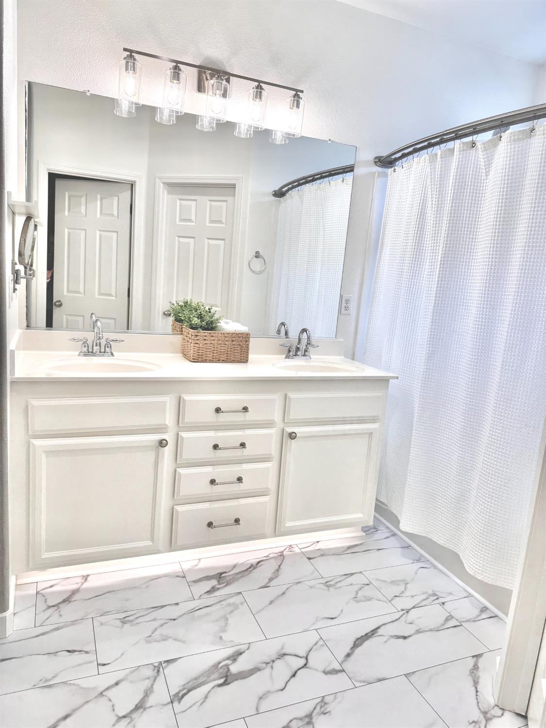 12372 Pawcatuck Way Rancho Cordova, CA 95742 - Photo 20 of 48 a bathroom with a sink double vanity and a mirror