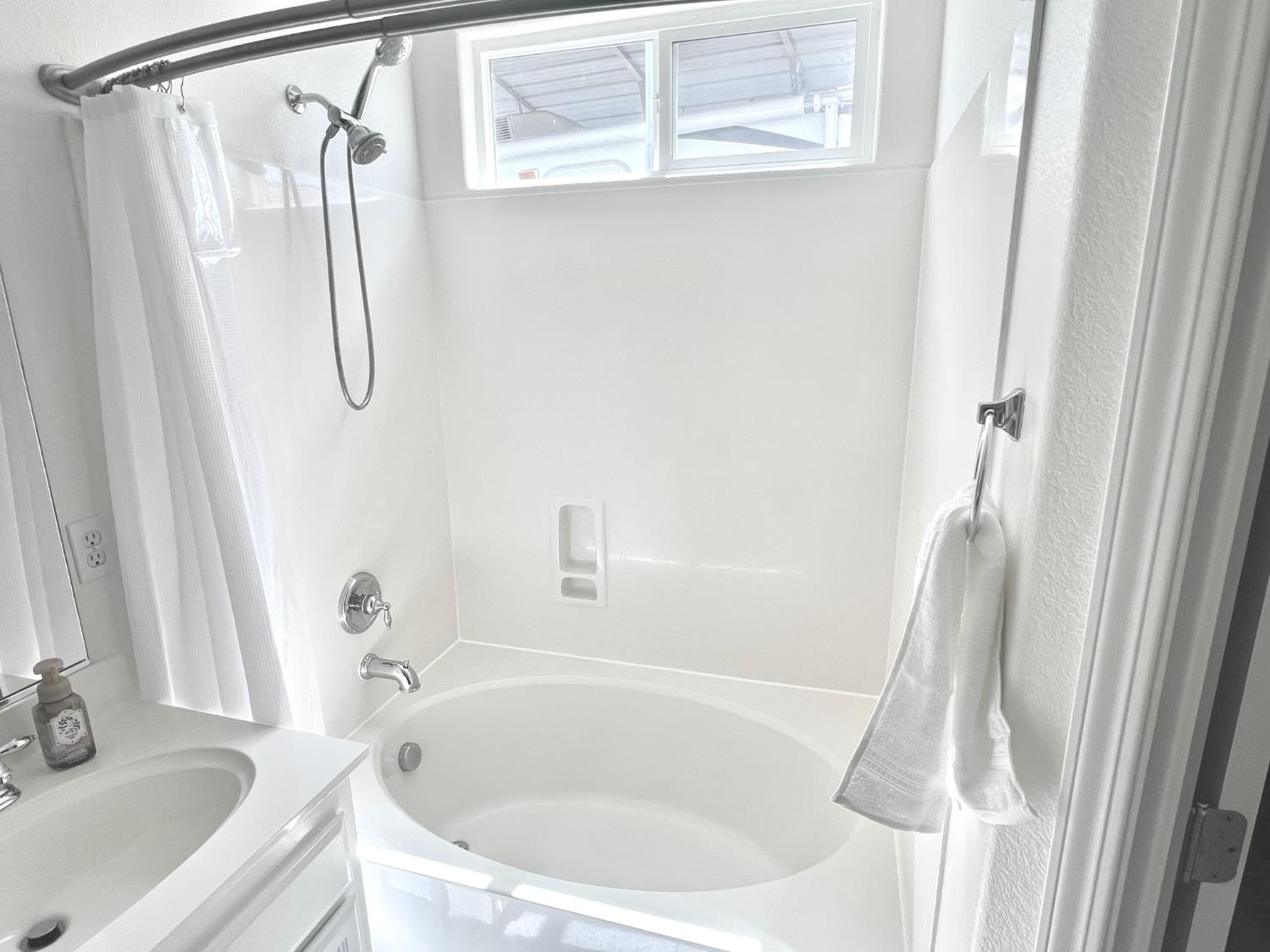 12372 Pawcatuck Way Rancho Cordova, CA 95742 - Photo 21 of 48 a white bath tub sitting next to a white sink and a tub