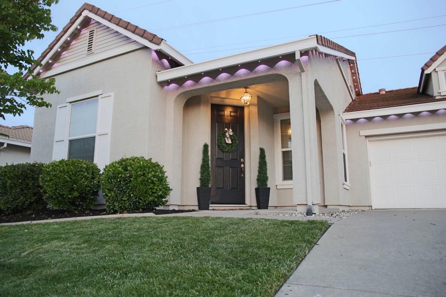 12372 Pawcatuck Way Rancho Cordova, CA 95742 - Photo 3 of 48 front view of a house with a small yard